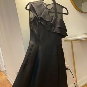 Luxury Christian Dior knee length black satin dress.